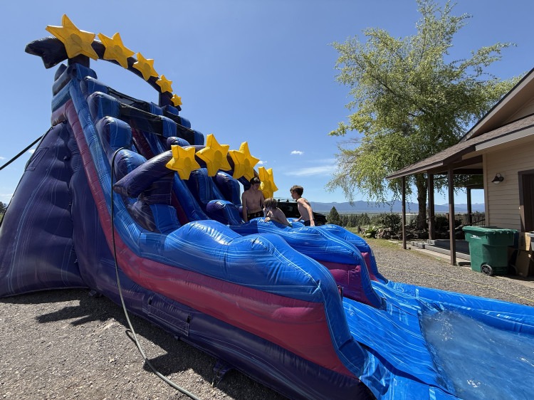 Galaxy inflatable water slide set up for a Southern Oregon birthday party